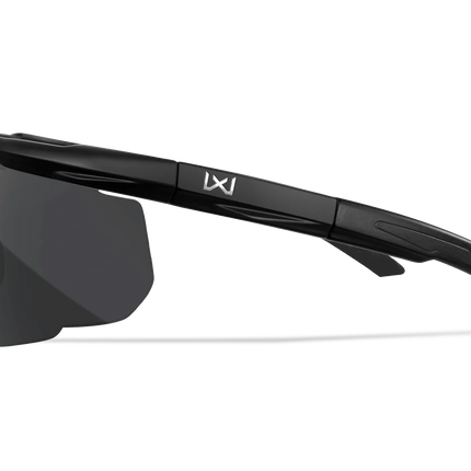 Black wrap-around sunglasses with a dark tinted lens and a white LX logo on the temple, shown from a side profile on a white background.